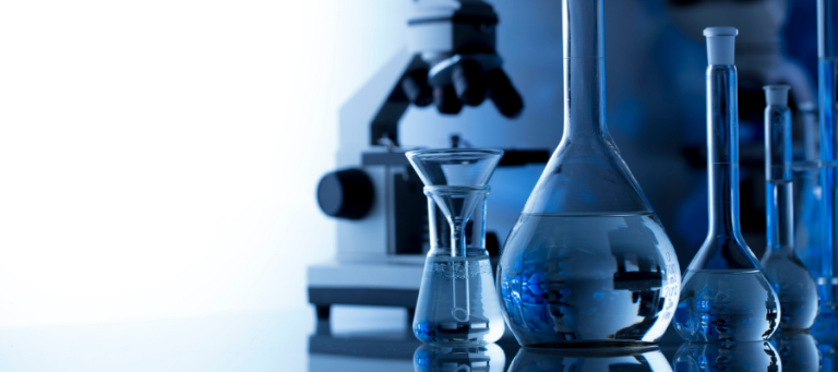 Laboratory glassware and microscope; science equipment.