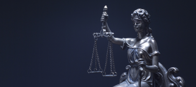 Lady Justice statue holding scales of justice