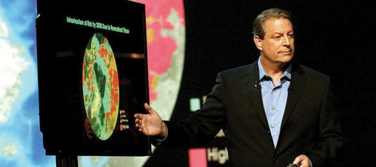 Al Gore presenting a climate change graph.