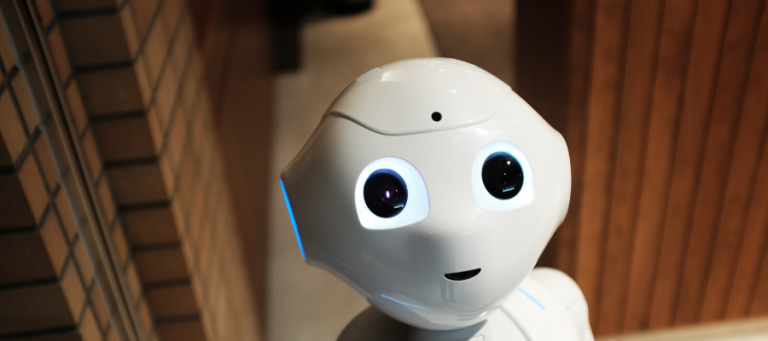 Close-up of a friendly-looking robot's face.