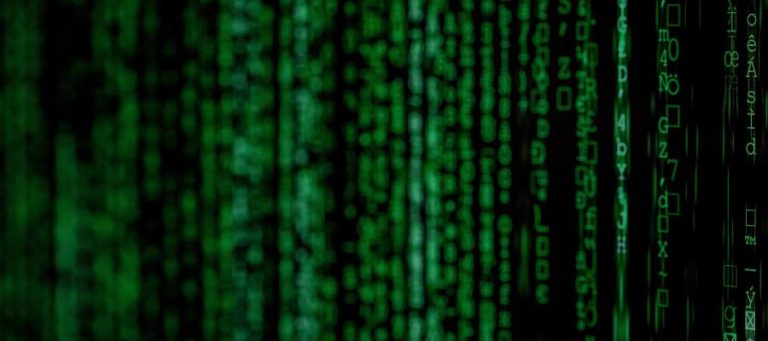 Abstract green digital code streaming down the screen.