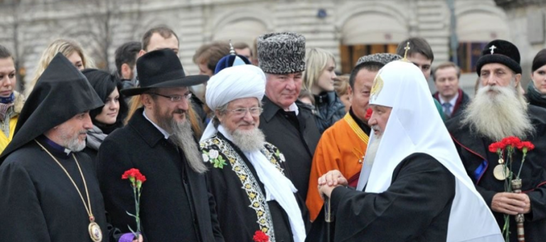 Religious leaders of different faiths stand together, symbolizing interfaith unity.