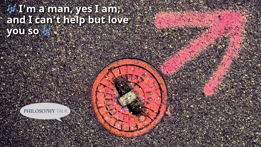 Red utility cover on asphalt with pink markings; lyrics "I'm a man, yes I am, and I can't help but love you so