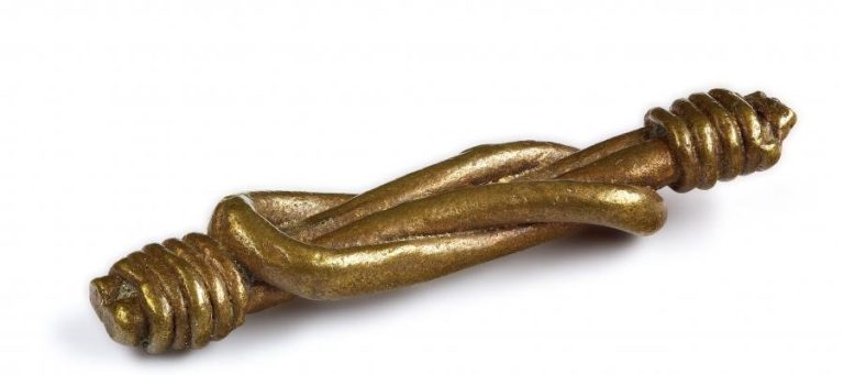 Brass weight with intertwined rope design.
