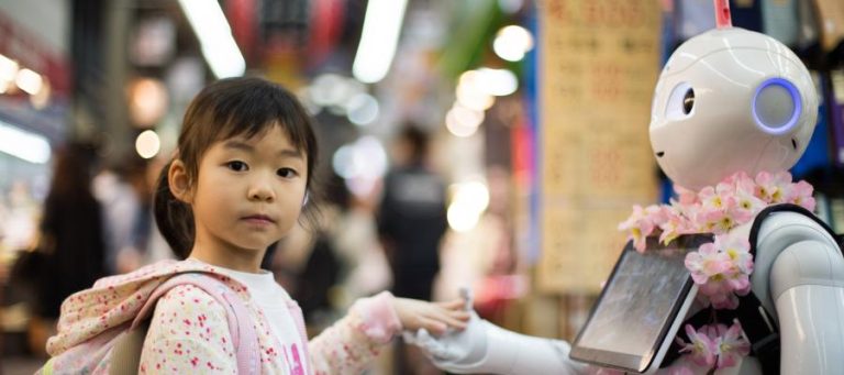 Young girl interacting with a friendly robot.