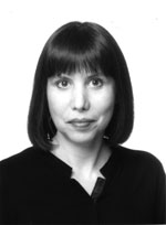 Black and white headshot of a woman with shoulder-length hair.