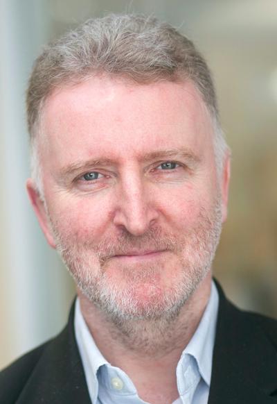 Headshot of a man, possibly a wine expert, discussing the philosophy of wine.
