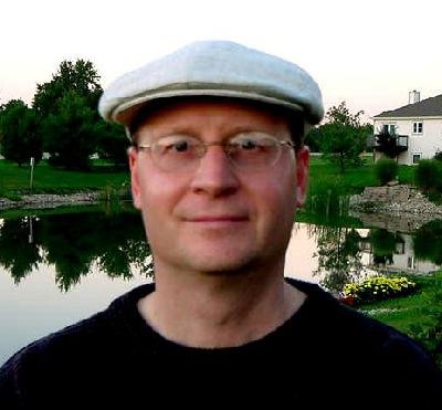 Friendly man wearing a newsboy cap