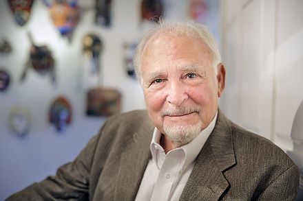 Portrait of an older man with a kind expression. He appears thoughtful and sincere.