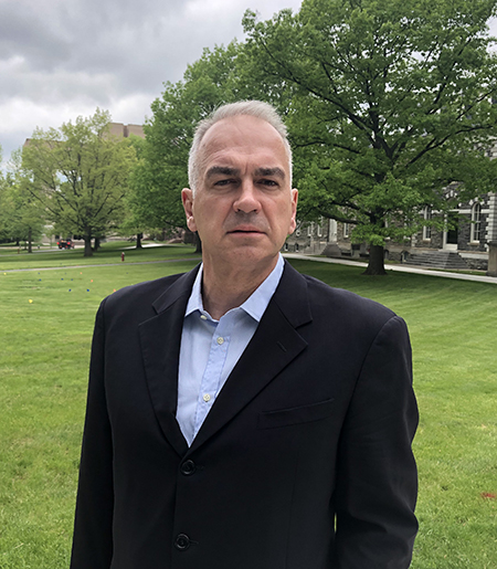 Portrait of a man in a dark suit, possibly a philosopher or academic.