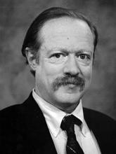 Black and white portrait of a man with a mustache