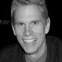 Headshot of a smiling man