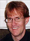 Friendly man with glasses, smiling