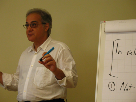 Man giving presentation, discussing relativity