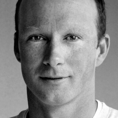 Black and white portrait of a man, possibly discussing philosophy.