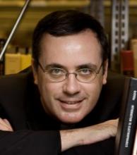 Headshot of Dr. Michael Heiser, author of *The Unseen Realm*.