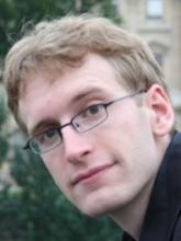 Young man with glasses, possibly a musician