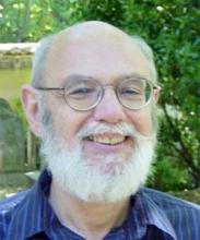 Happy older man with glasses and beard