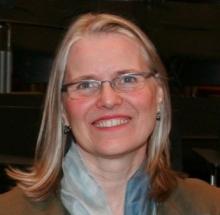 Friendly woman with glasses, showing unconditional love.