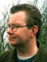 Headshot of philosopher, contemplating morality.